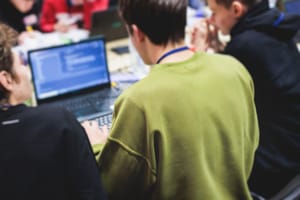 Software,Developer,Students,In,Auditorium,Hall,Working,On,Computer,And trader hacker laptop screen man