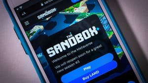 Een afbeelding van het cryptoproject the sandbox als mobiele game op een telefoon Een afbeelding van het cryptoproject the sandbox als mobiele game op een telefoon
