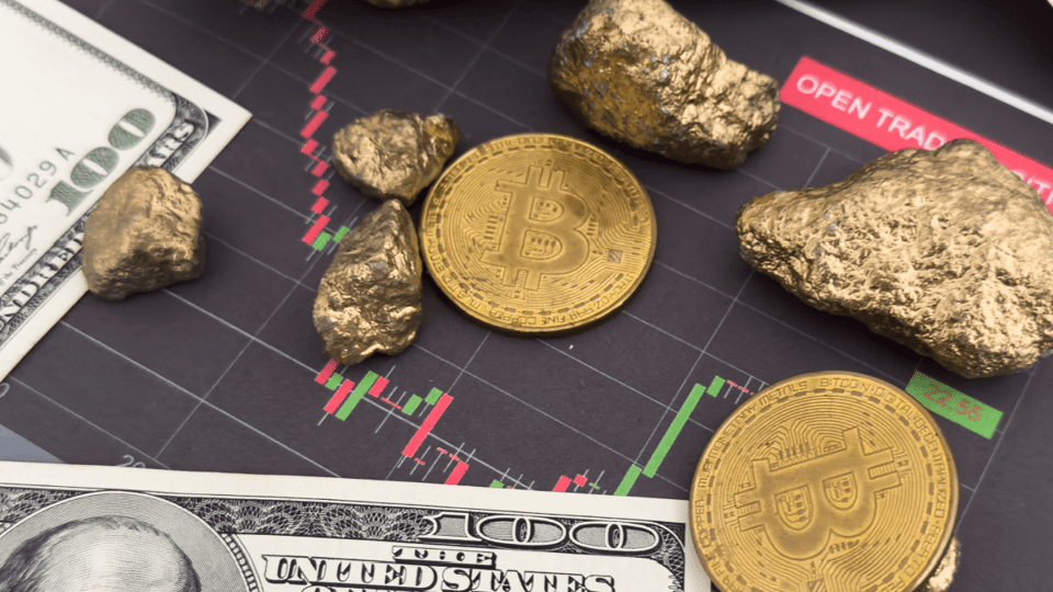 Bitcoins goudklompen dollars en een koersgrafiek