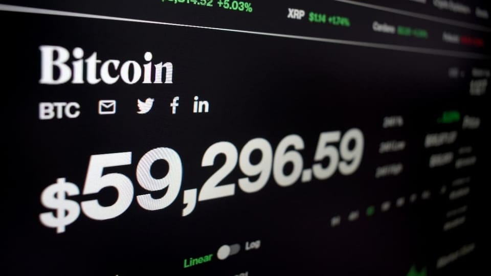 Een afbeelding van de bitcoin koers net onder de 60.000
