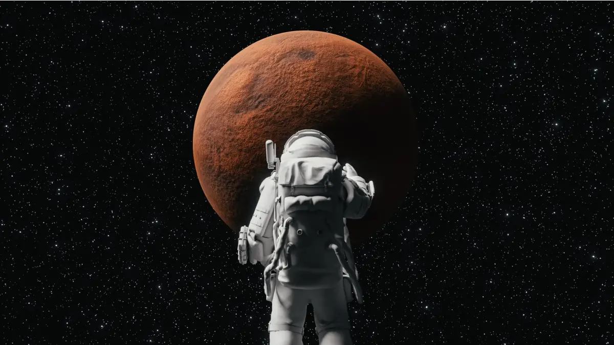Een afbeelding van een Astronaut die naar Mars aan het kijken is Een afbeelding van een Astronaut die naar Mars aan het kijken is